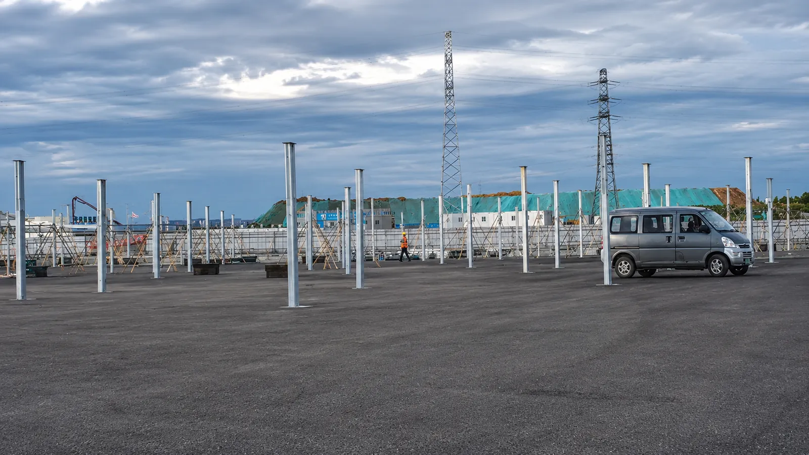 Steel columns set out across the car park before the canopy frames were lifted